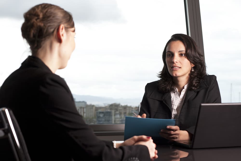 Concussion injury lawyer with client in a nice office