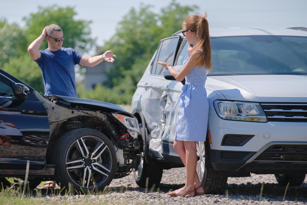 A man and a women assessing the damages after the cars collision in Fort Lauderdale.